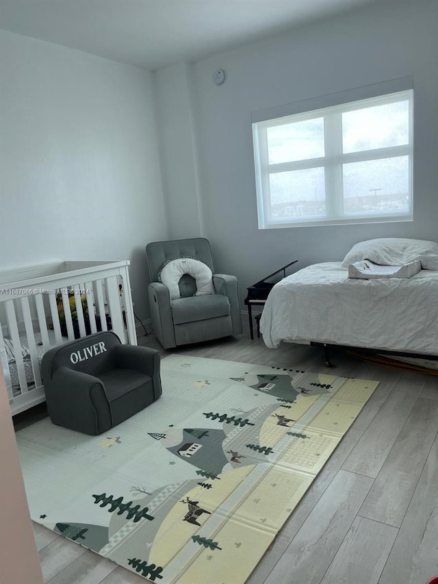 bedroom featuring wood-type flooring