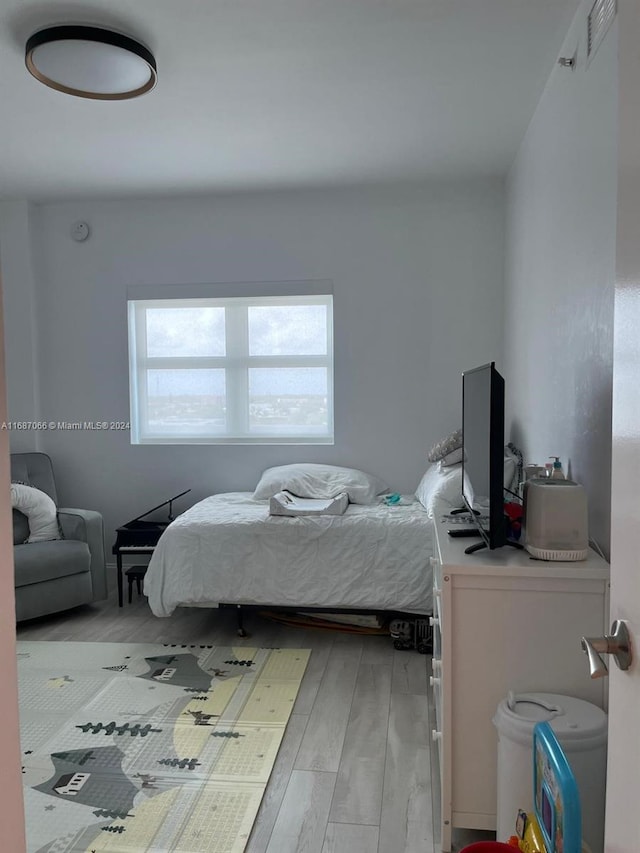 bedroom with light hardwood / wood-style flooring