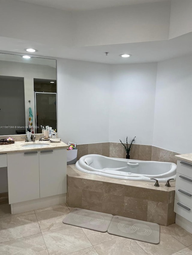 bathroom with vanity, separate shower and tub, and tile patterned flooring