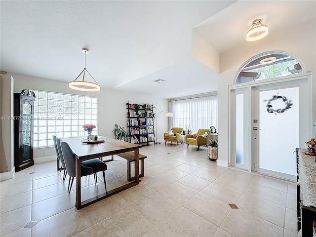 dining space featuring light tile patterned floors