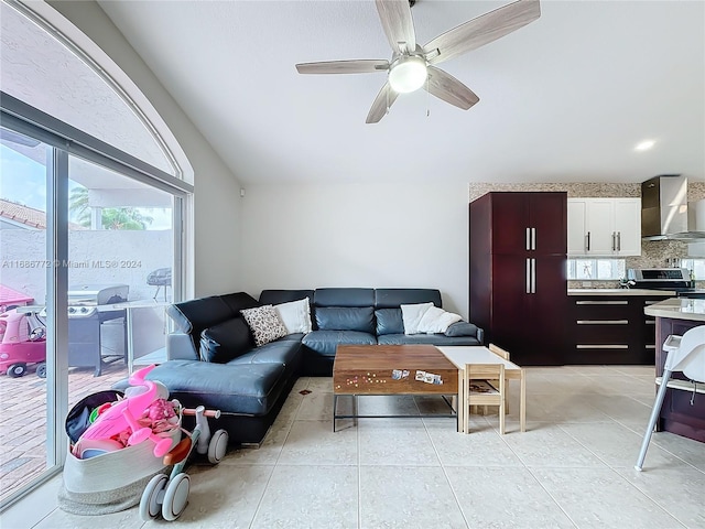 living room with light tile patterned floors and ceiling fan