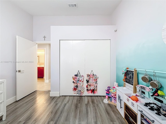 game room with light wood-type flooring