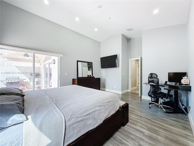 bedroom featuring hardwood / wood-style flooring and high vaulted ceiling