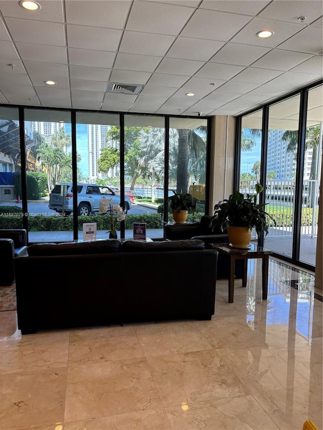 building lobby featuring expansive windows and recessed lighting