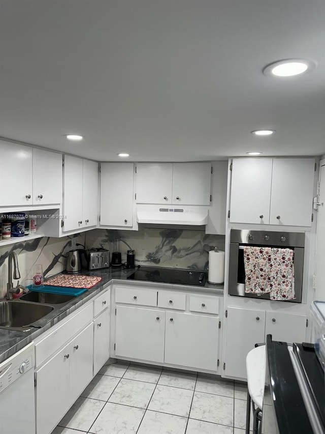 kitchen featuring oven and white cabinets