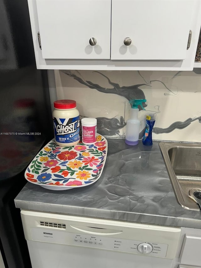 room details with white cabinetry, dishwasher, and sink