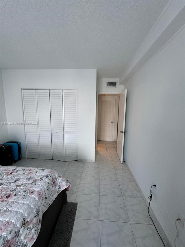 bedroom featuring a textured ceiling