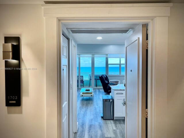 hallway with light wood-type flooring