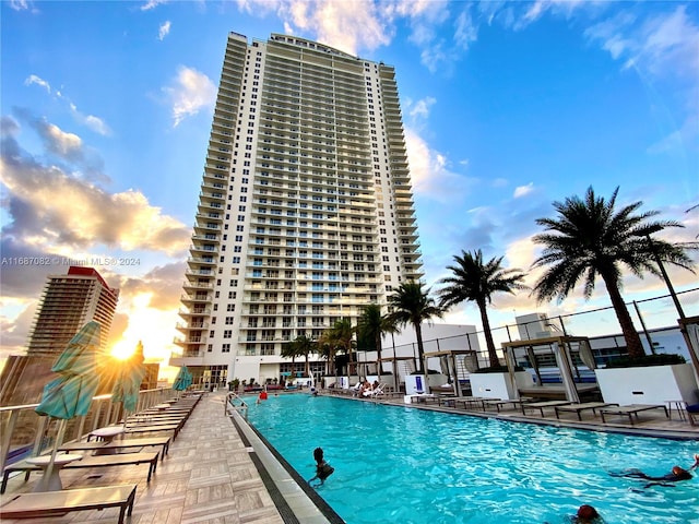 view of pool at dusk