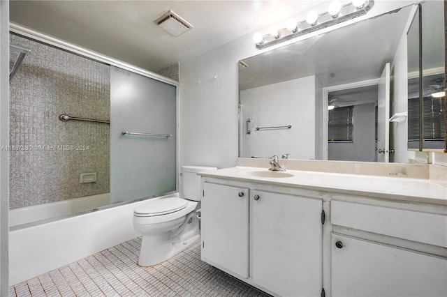 full bathroom with ceiling fan, shower / bath combination with glass door, toilet, vanity, and tile patterned flooring