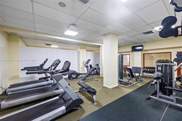 workout area featuring a drop ceiling