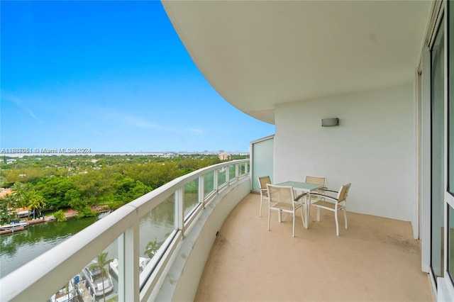 balcony featuring a water view