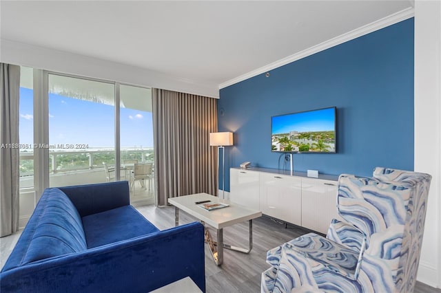 4401 Collins Ave Unit 1214, Miami Beach, FL 33140 - living room featuring crown molding and light wood finished floors