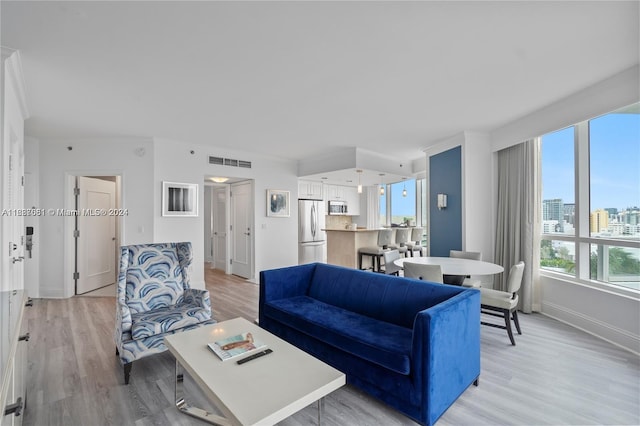 4401 Collins Ave Unit 1214, Miami Beach, FL 33140 - living area with light wood finished floors and a city view