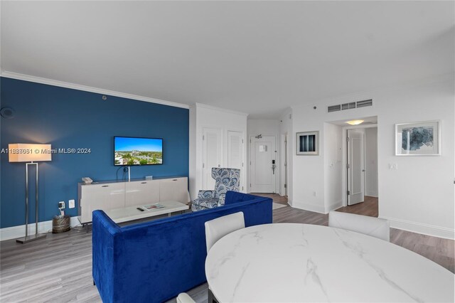 4401 Collins Ave Unit 1214, Miami Beach, FL 33140 - living area featuring wood finished floors and crown molding