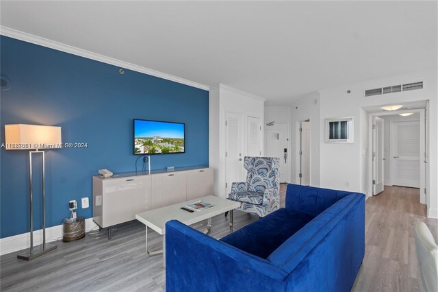 4401 Collins Ave Unit 1214, Miami Beach, FL 33140 - living area featuring wood finished floors and crown molding