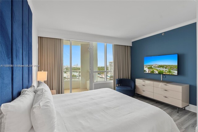 4401 Collins Ave Unit 1214, Miami Beach, FL 33140 - bedroom with crown molding and wood finished floors