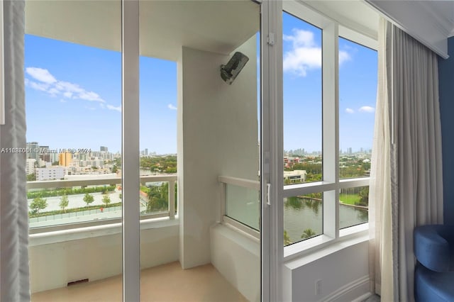 interior space featuring a water view and a healthy amount of sunlight