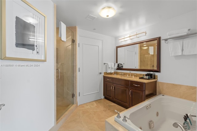 bathroom featuring separate shower and tub and vanity