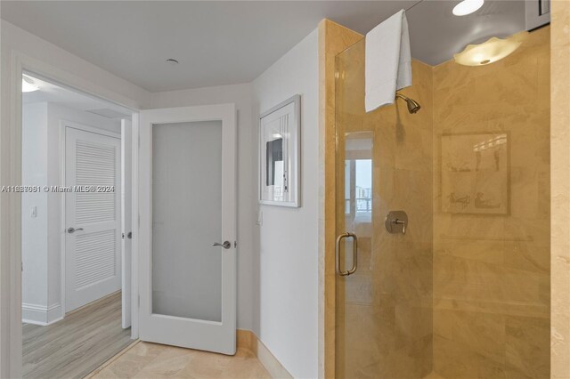 4401 Collins Ave Unit 1214, Miami Beach, FL 33140 - full bathroom with a stall shower and baseboards