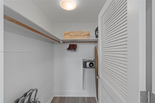 walk in closet featuring hardwood / wood-style floors