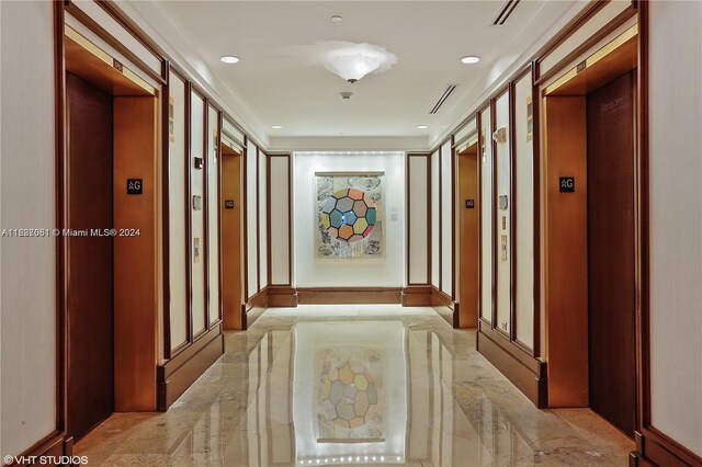4401 Collins Ave Unit 1214, Miami Beach, FL 33140 - hallway with elevator, light marble finish floors, and recessed lighting