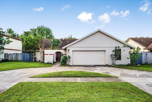 ranch-style home with a garage and a front lawn