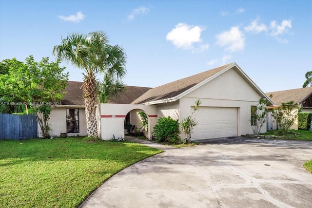 ranch-style home with a front lawn and a garage