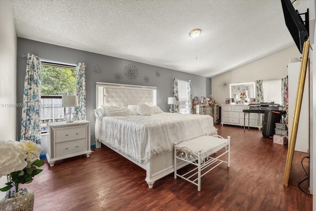 bedroom featuring lofted ceiling, a textured ceiling, and dark hardwood / wood-style flooring