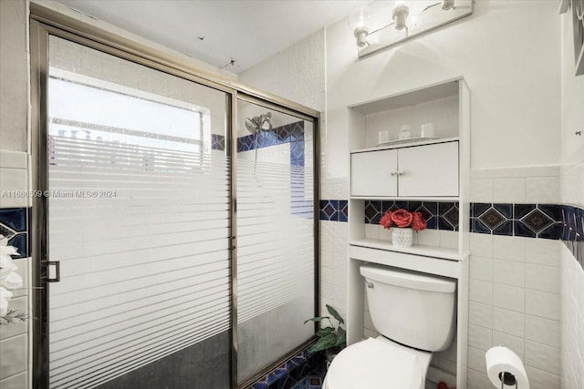 bathroom with toilet, walk in shower, and tile walls