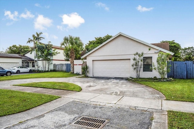 single story home with a front lawn and a garage