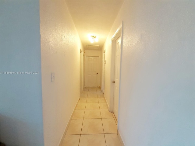 hall with light tile patterned flooring