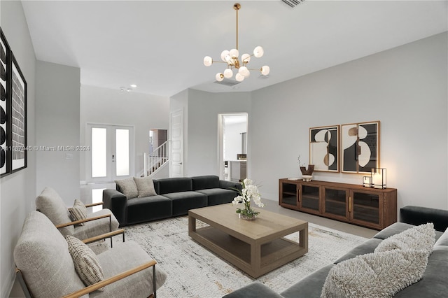 living room featuring a notable chandelier