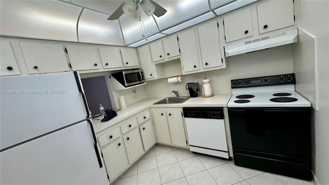 kitchen featuring ceiling fan, sink, tasteful backsplash, white appliances, and light tile patterned flooring