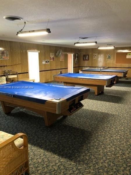 game room with wood walls, carpet, and billiards