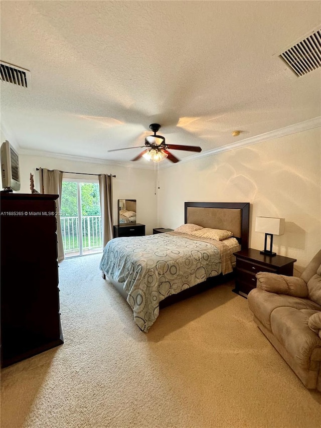 carpeted bedroom with access to outside, ceiling fan, crown molding, and a textured ceiling