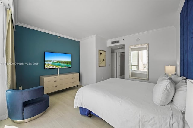 bedroom with crown molding and light wood-type flooring