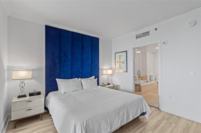 bedroom with crown molding, connected bathroom, and light hardwood / wood-style flooring