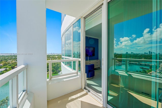 balcony featuring a water view