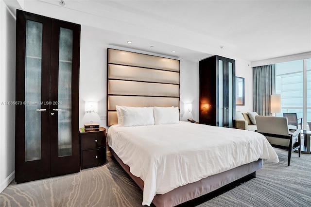 bedroom with expansive windows and french doors