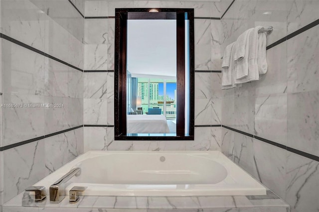 bathroom featuring tiled bath