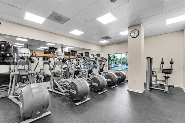 exercise room featuring a drop ceiling