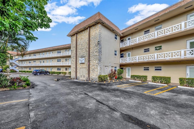 5103 NW 35th St Unit 607, Lauderdale Lakes, FL 33319 - view of apartment building / complex with uncovered parking