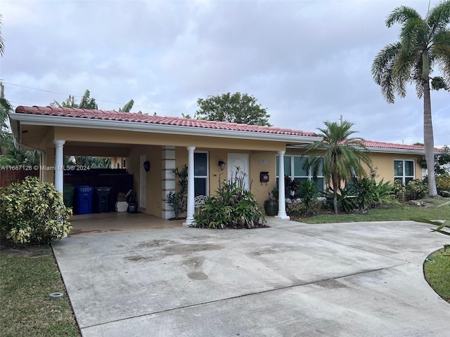 view of front of house featuring a carport