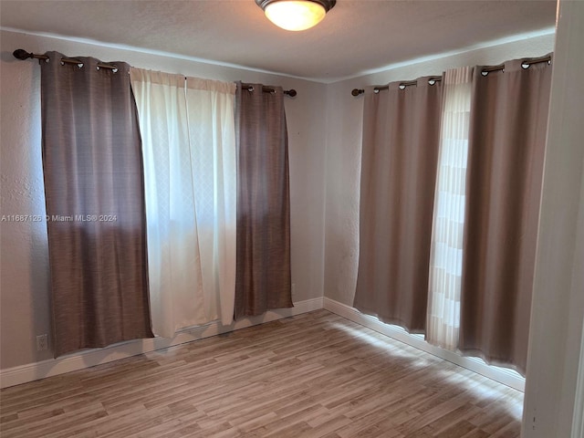 spare room with light wood-type flooring