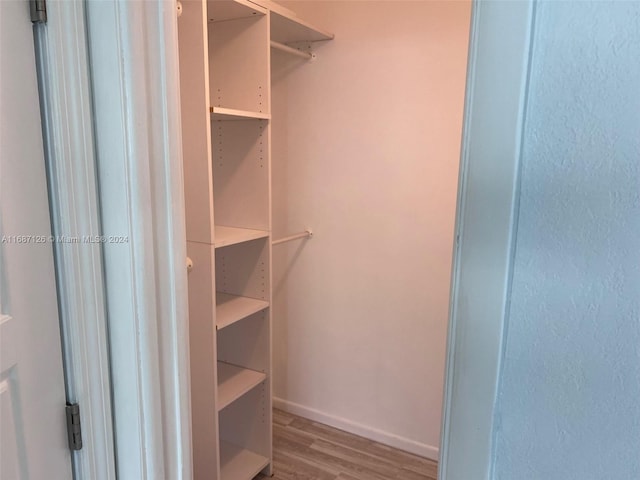 walk in closet featuring light wood-type flooring