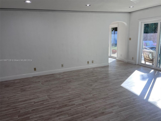 spare room featuring dark wood-type flooring