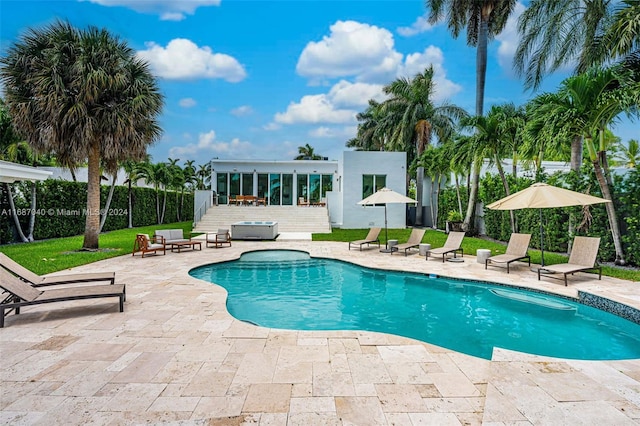 view of swimming pool with a patio area