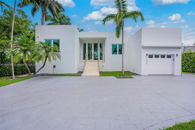 view of front of house featuring french doors and a garage