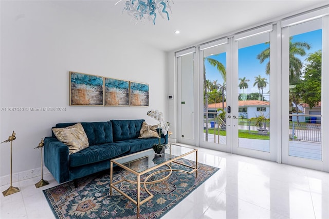 living room featuring french doors and expansive windows